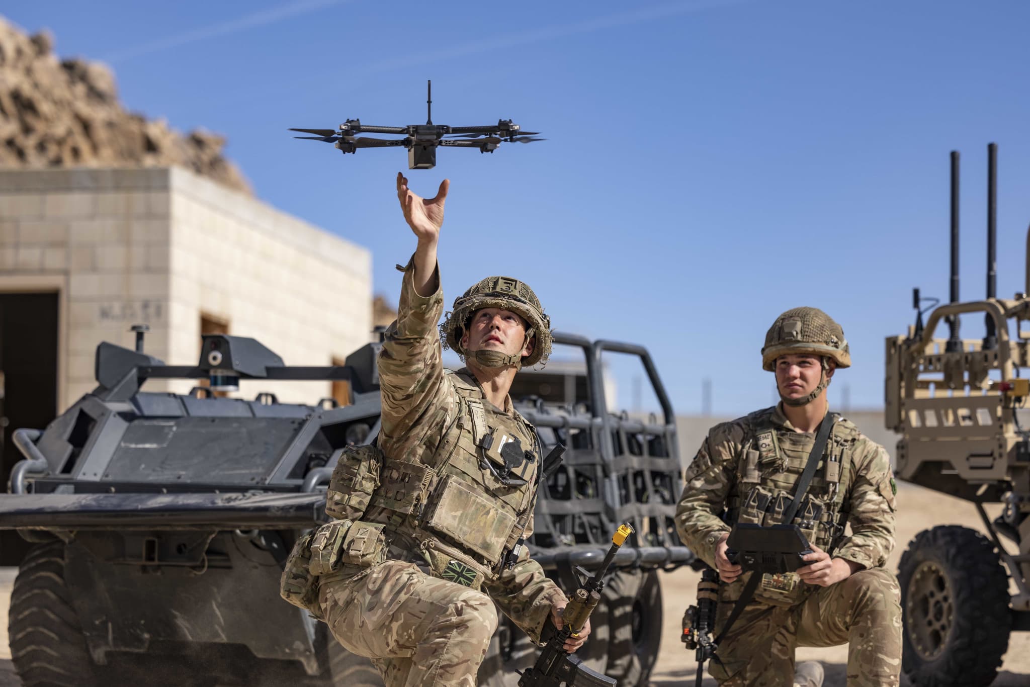 Soldiers at Fort Irwin, California launch a SkyDIO unmanned aerial vehicle during a training exercise.